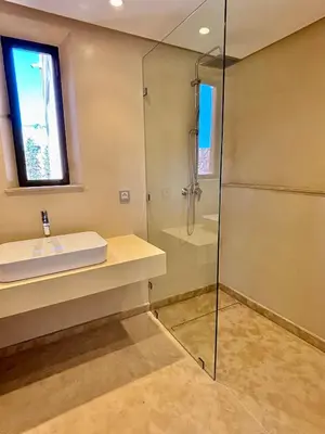 a bathroom with a shower and a sink at Palais Kenza in Marrakech