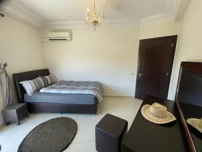 a small room with a bed and a table at Apartement de Luxe mit Tiefgarage in Marrakech