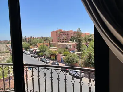 a view of a city street from a balcony at Apartement de Luxe mit Tiefgarage in Marrakech