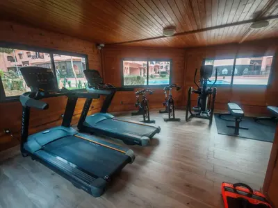 an overhead view of a gym with exercise bikes at Luxury Apartment in Marrakech Premium Village 5 Pools free Parking in Marrakech