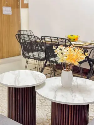two tables with a vase of flowers on top of them at Cozy Apt Close to Gueliz Medina in Marrakech