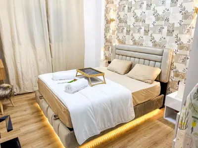 a bedroom with a bed with a tray on it at Cozy Apt Close to Gueliz Medina in Marrakech