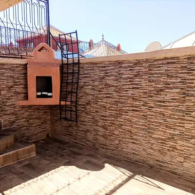 a brick wall with a brick oven on it at Riad Malika et Cristina in Marrakech