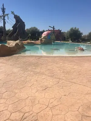 a pool of water in a theme park at Appartement le vizir center in Dar Caïd Layadi