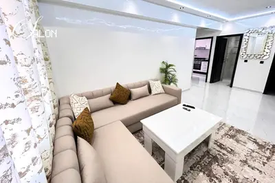 a living room with a couch and a table at Stylish & Cozy Apartment in Marrakech in Marrakech