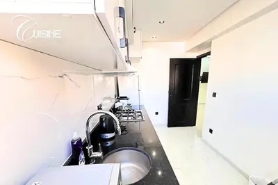 a kitchen with a sink and a counter top at Stylish & Cozy Apartment in Marrakech in Marrakech