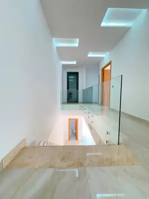 a room with white walls and a glass floor at Villa Emeraude 15 minutes du centre in Marrakech