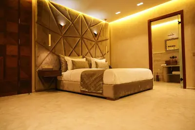 a bedroom with a large bed and a large mirror at Luxury Resort Loudi Marrakech in Marrakech