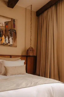 a bedroom with a bed and a large window at Luxury Resort Loudi Marrakech in Marrakech