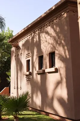 a shadow of a building with two windows at Luxury Resort Loudi Marrakech in Marrakech