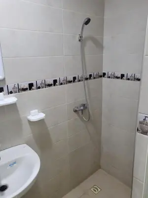 a bathroom with a shower with a toilet and a sink at Maison D'hôte Dar ALBIDAWI CH5 in Marrakech