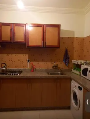 a kitchen with a sink and a washing machine at Modern 2bedroom full furnished in downtown in Marrakech