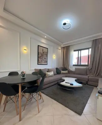a living room with a couch and a table at Elegant Apartment Marrakech in Marrakech