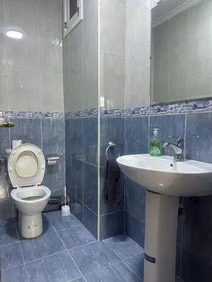 a bathroom with a toilet and a sink at Charmant & chic à Gueliz in Marrakech