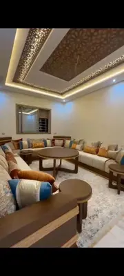 a large living room with couches and a table at Appartement de rêve in Marrakech