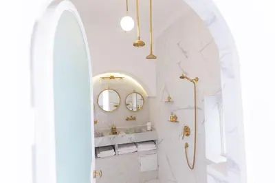 a bathroom with a sink and a mirror at Riad JONCHÈRES in Marrakech
