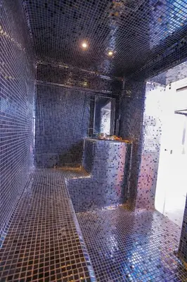 a room with a shower with a tiled floor at Golf el maaden Splendide villa in Marrakech