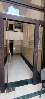 an empty hallway with a glass door in a building at Picasso - Appartement 1 chambre in Marrakech
