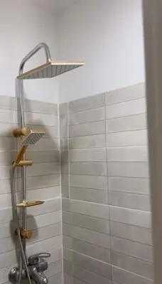 a shower with a shower head in a bathroom at 2-bedroom flat in Gueliz in Marrakech