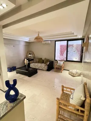a living room with a couch and a table at Bleu Majorelle, cœur de Gueliz in Marrakech