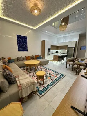a living room with a couch and a table at Riad De Luxe Marrakech in Marrakech