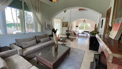 a living room with a couch and a table at Dar El Hana 4 Bedroom Villa in Marrakech