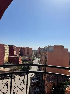 a view of a city street from a balcony at Cozy flat in Marrakesh in Marrakech