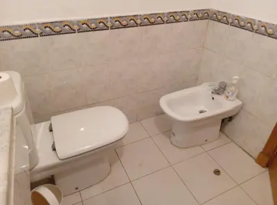 a white bathroom with a toilet and a sink at Modern 2 Bedroom Appartement in Gueliz in Marrakech