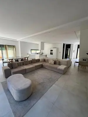 a large living room with a couch and a table at Villa spacieuse à Marrakech avec piscine privée_222 in Marrakech