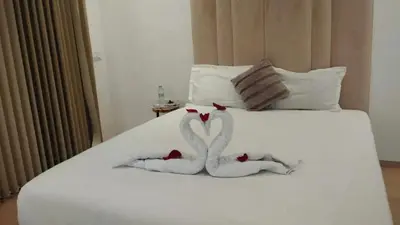 a bed with two towels shaped like hearts on it at Villa spacieuse à Marrakech avec piscine privée_222 in Marrakech
