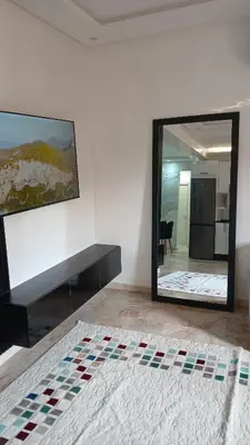 a room with a mirror on the wall at Cosy appartement Victor Hugo in Marrakech