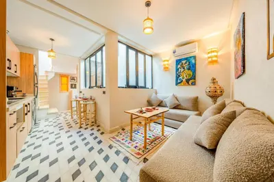 a living room with a couch and a table at Dar mehdi in Marrakech