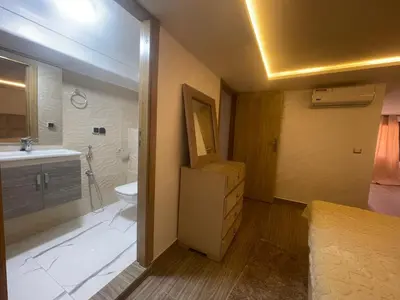 a bathroom with a sink and a toilet and a sink at Appartement downtown marrakech in Marrakech