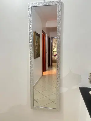 a mirror on a wall in a hallway at Elegant appartement a Gueliz in Marrakech