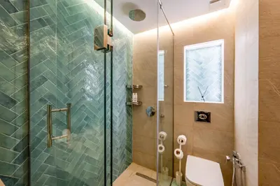 a bathroom with a glass shower with a toilet at Le Darna - Marrakech Victor Hugo - 2prs - Wifi in Marrakech