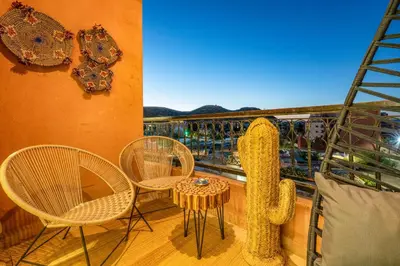 a balcony with chairs and a table and a ladder at Le Darna - Marrakech Victor Hugo - 2prs - Wifi in Marrakech