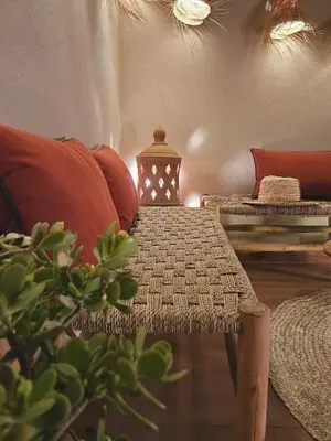 a room with a couch and a table with a lamp at RIAD AWEL - 3 chambres & jacuzzi au coeur de la Medina in Marrakech