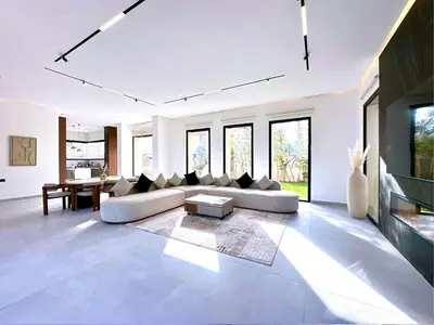 a living room with a couch and a table at Modern Villa Assia in Marrakech