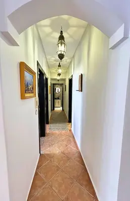 a hallway of a house with an archway at Perle Au cœur de Gueliz avec Piscine et 100m2 in Marrakech