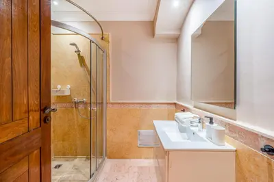 a bathroom with a sink and a shower at Cozy Stay with Garden & Pool, 10min to Center in Marrakech