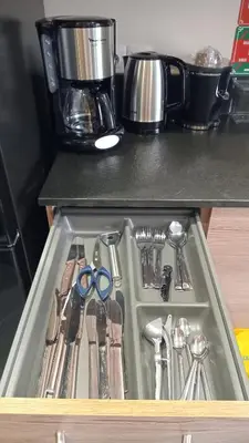 a drawer with scissors and other utensils in a kitchen at Coeur de Marrakech Majorelle 2ch Parking in Marrakech