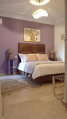 a bedroom with a large bed in a room at Coeur de Marrakech Majorelle 2ch Parking in Marrakech