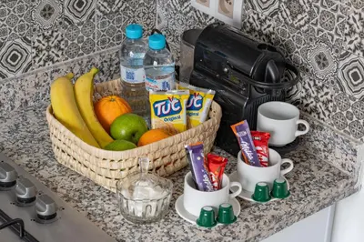 a basket of fruit and drinks on a counter at Appartement Luxe à Marrakech in Marrakech