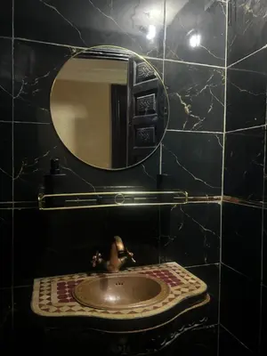 a bathroom with a sink and a mirror at Riad Marrakech in Marrakech