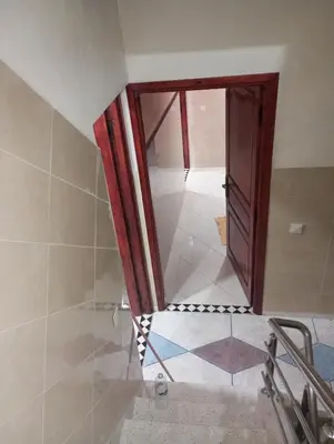 a shower with a glass door in a bathroom at dar immi in Marrakech