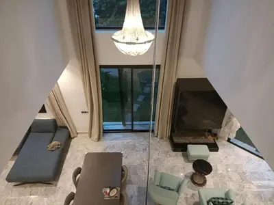an overhead view of a living room with a large window at Luxurious villa in Marrakech