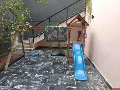 a room with a slide and a staircase with a slide at Luxurious villa in Marrakech