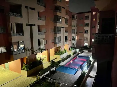 an overhead view of a building with a swimming pool at Spacieux 3 chambre au Coeur de Marrakech in Marrakech