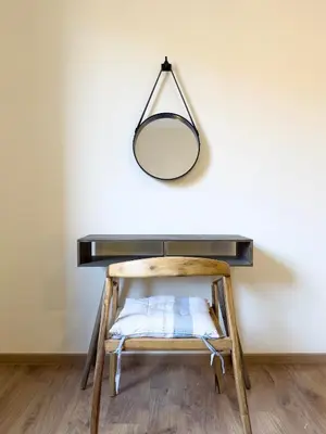 a mirror hanging over a desk with a chair at Maison de Vacances Targa avec Piscine & Terrasse à Marrakech in Marrakech
