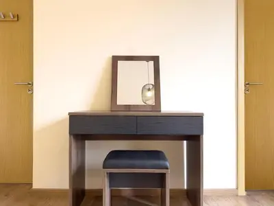 a desk with a mirror and a stool under it at Maison de Vacances Targa avec Piscine & Terrasse à Marrakech in Marrakech